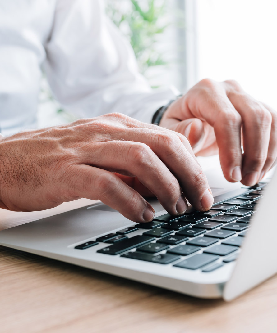 man is typing something on laptop man is typing something on laptop